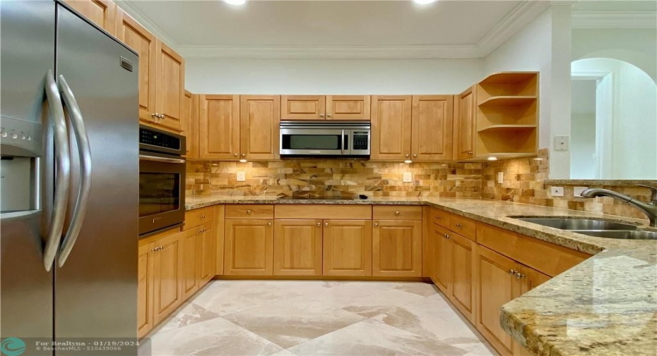 Wonderful kitchen with onyx backsplash.