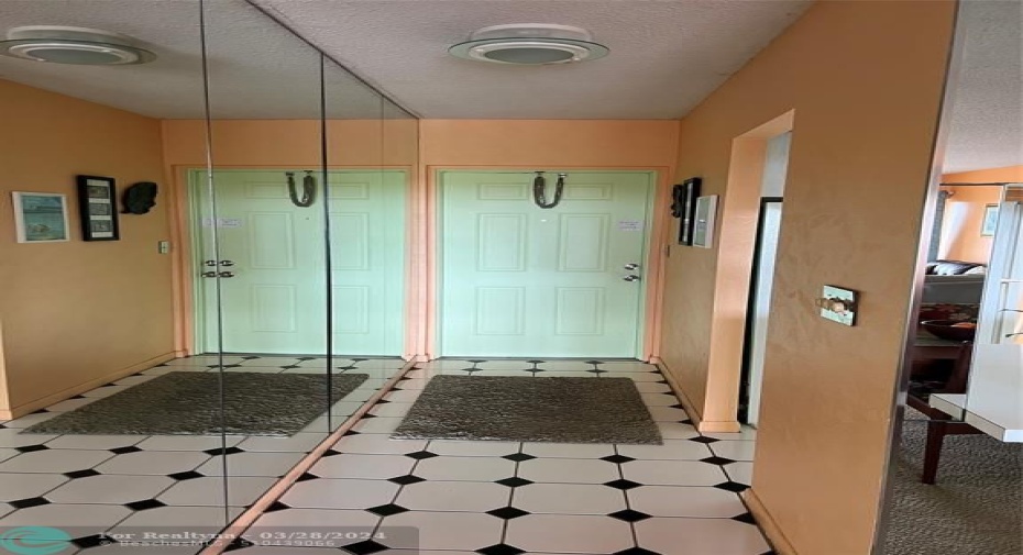 Nice entry foyer but wall can be removed to open up kitchen area