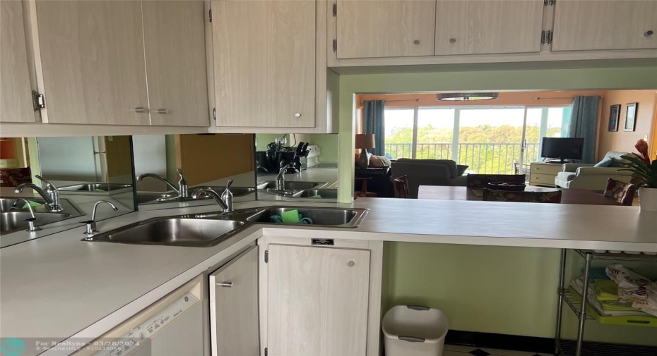Upper cabinets can be removed to open kitchen