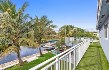 Outdoor balcony spans from one bedroom to the next making for easy entertaining.