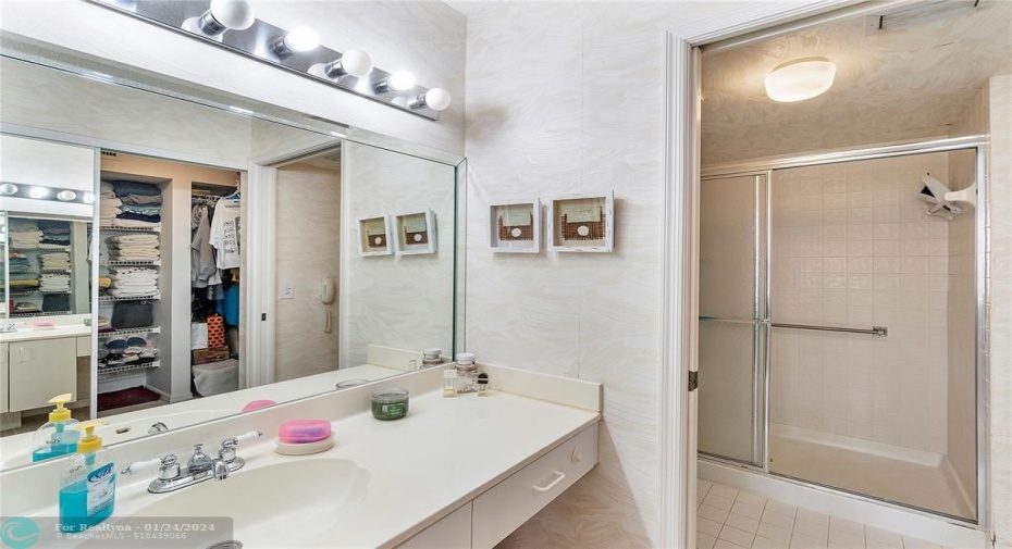 En Suite Bathroom within Primary Bedroom.  Notice ample closet space.