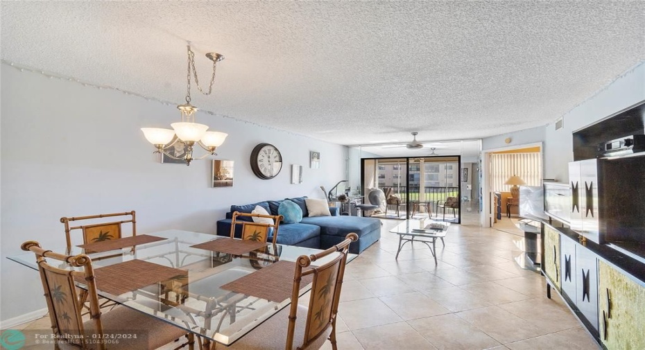 Dining Area with blend into Living Room area and out to Balcony and views.