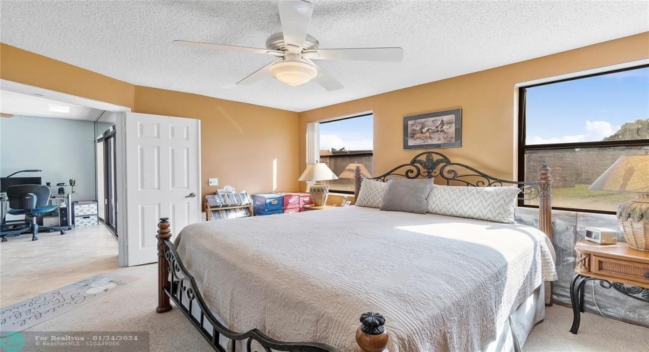 Primary Bedroom is gorgeous!  Double Door entry.  Great views to pond and golf course.