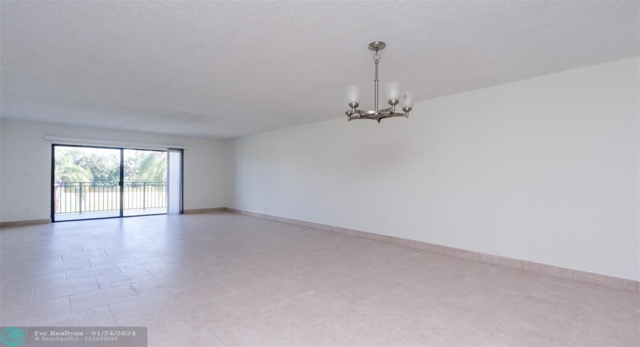 Spacious & very open Great Room with Living and dining Areas completely tiled throughout