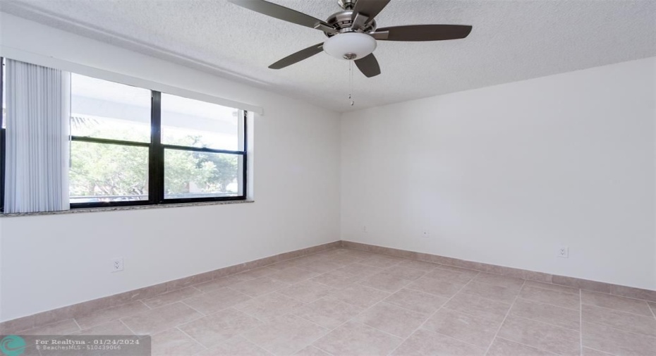 Guest/2nd bedroom completely tiled.