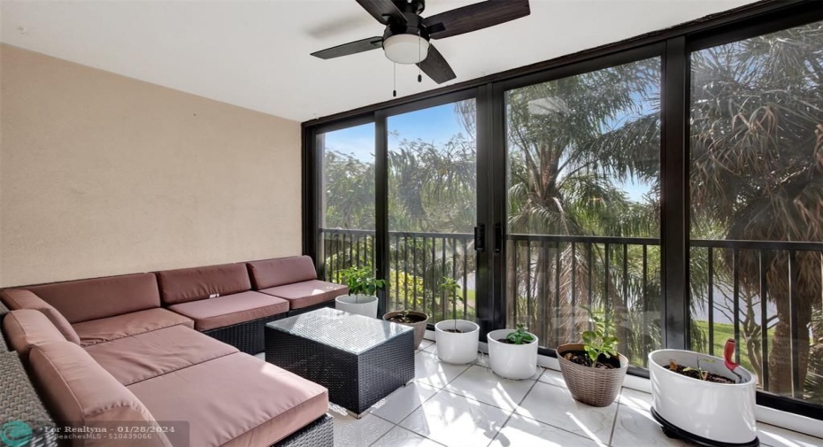Enclosed Balcony with High Impact Windows/Doors and view of Lake.