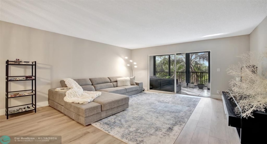 Open Living Area with access to Balcony/Den Area.