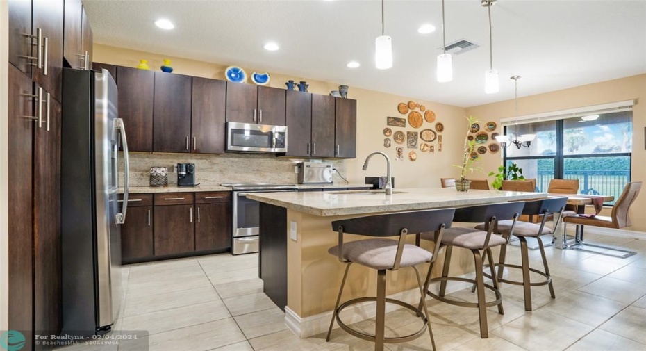 Kitchen with breakfast bar and dining area