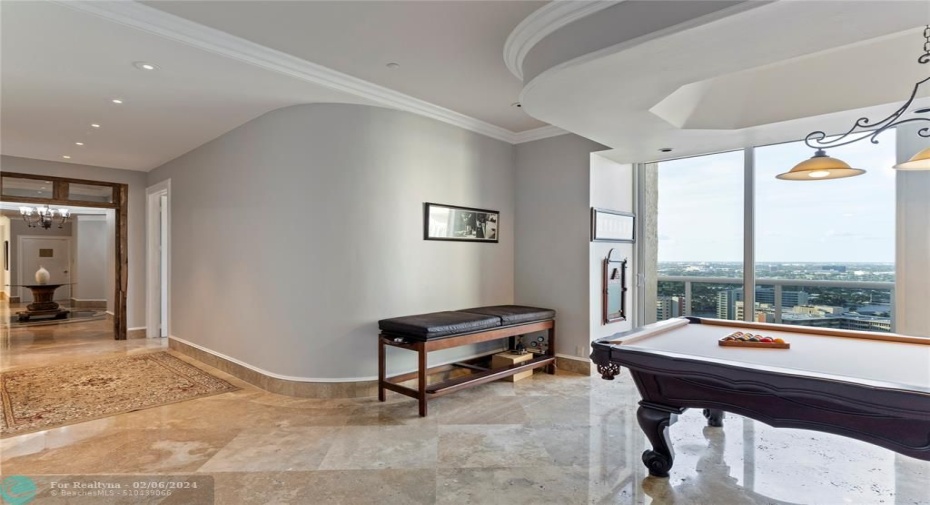 guest wing has billiard table in den