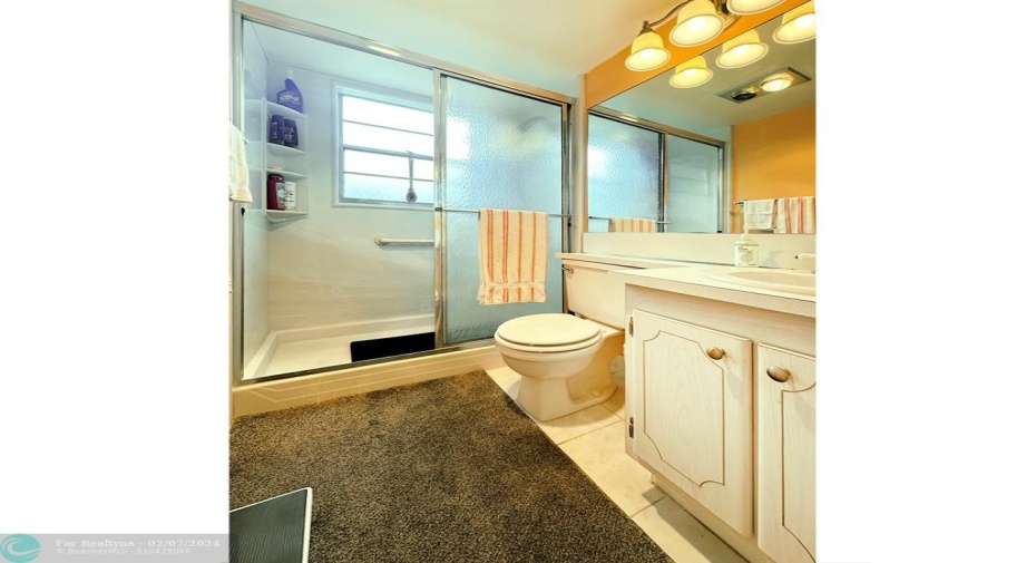 Primary Bathroom has Shower Stall w/Glass Doors