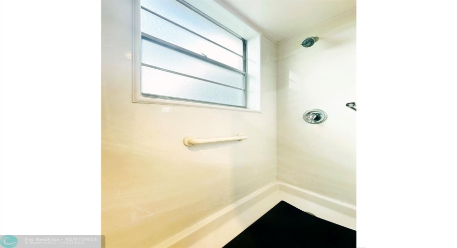Outside Window Brightens the Shower Stall.