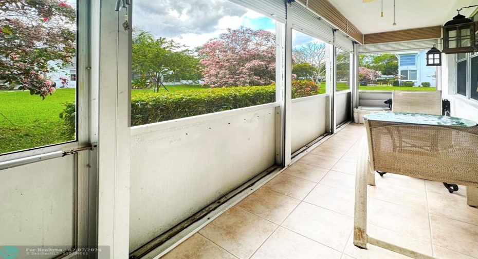 Screen Enclosed Patio has an Exit Door to the Garden Area.