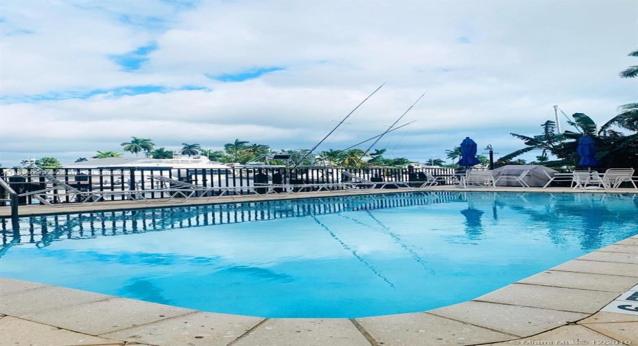 relax pool side with water views