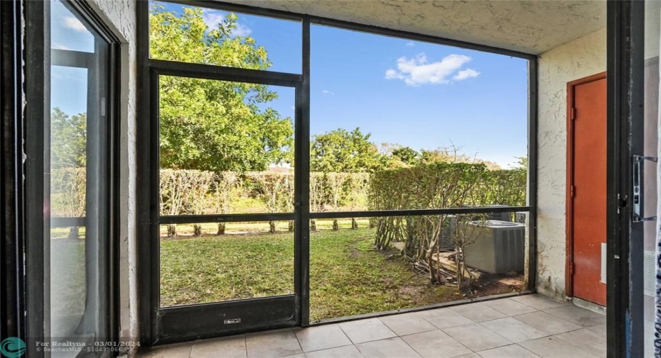 Screened patio has storage room