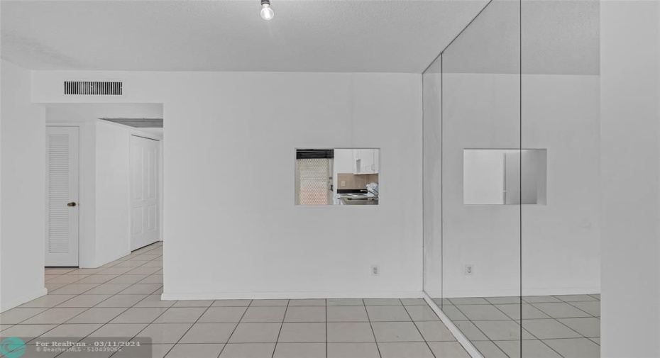 Dining room offers a convenient pass through window into the kitchen