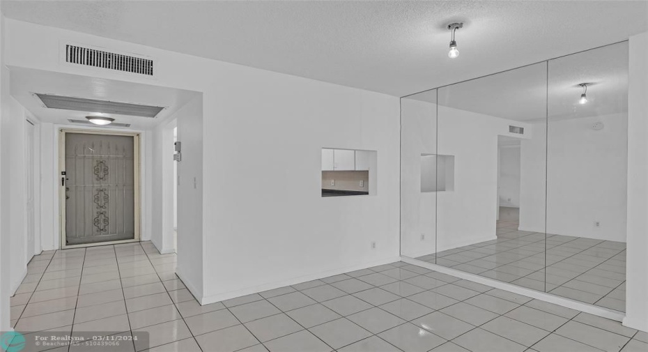 Large and spacious main foyer and dining room with tile flooring