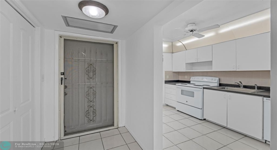 Main entrance into condo and spacious kitchen