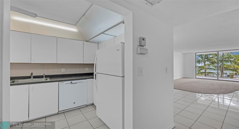 Kitchen and main living space offered in this waterfront condo