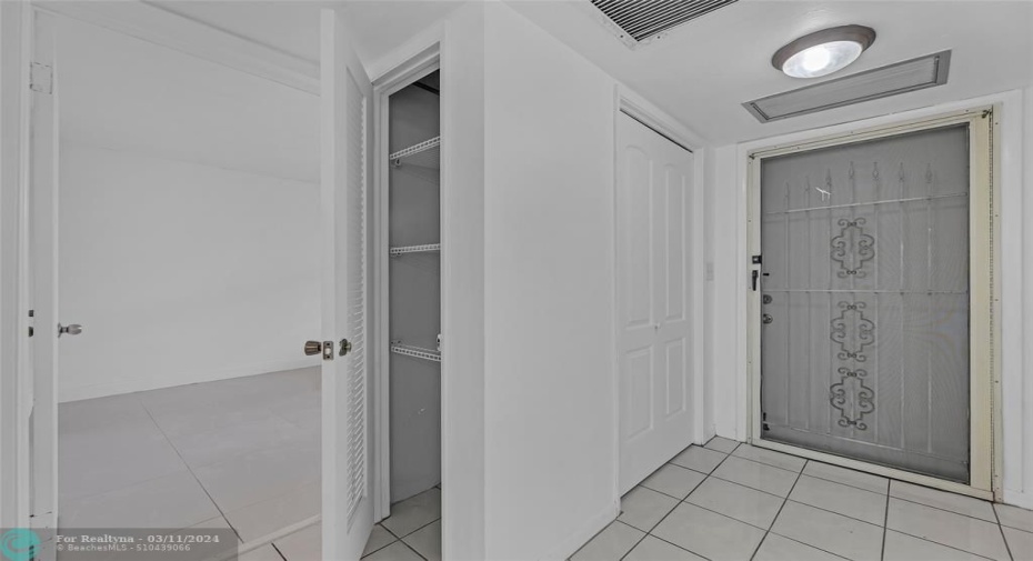 Main entrance offers closet in the foyer and a linen closet before entering front bedroom