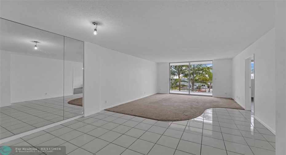 Large and spacious dining room and living room area with water views
