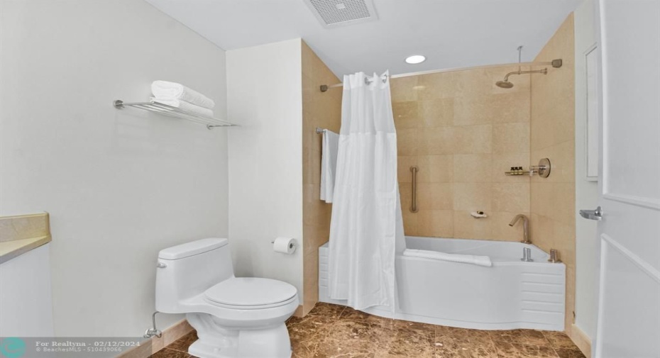 En suite bathroom in second bedroom.