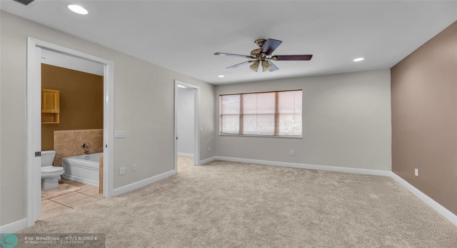Upstairs bedroom with full bath and walk-in closet.
