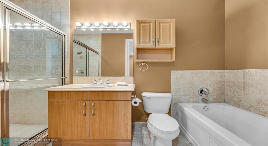 Primary bath with separate shower and spa tub.