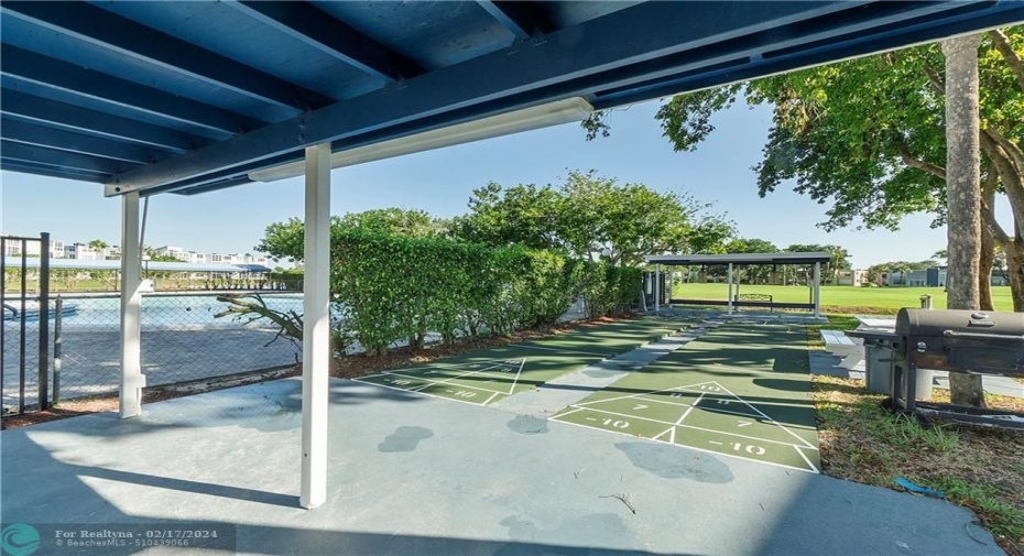 7624 has Shuffle Board Court next to pool