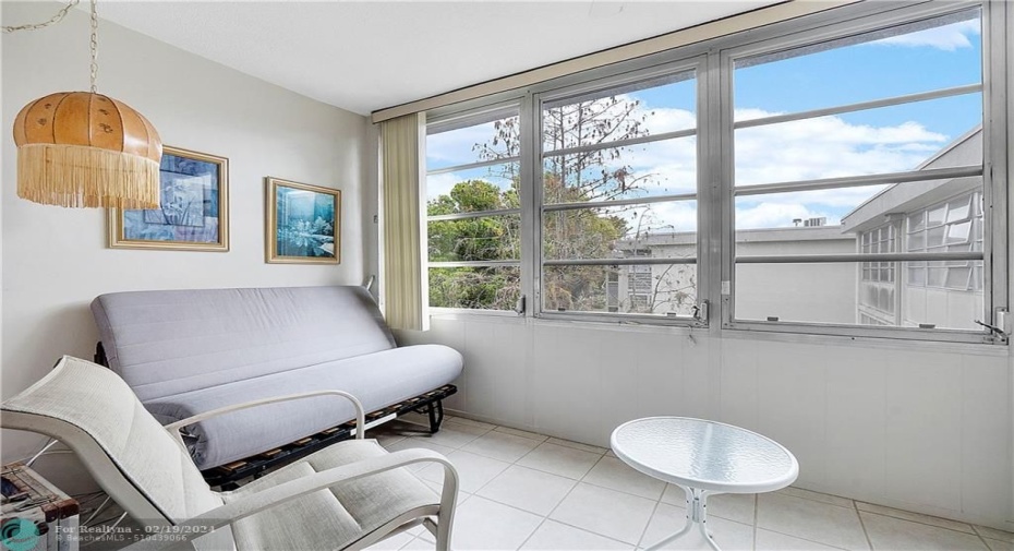 Enclosed patio with futon for extra bed when needed