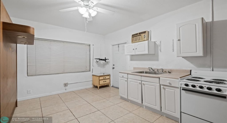 Converted garage is now a whole separate living area, with mini kitchen, bedroom, bathroom and separate entrance.