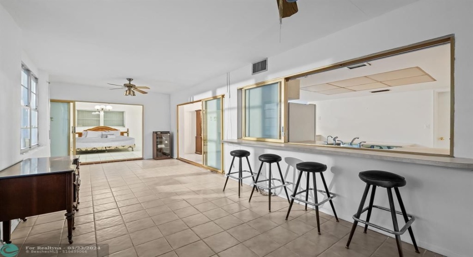 Great pass through window from the kitchen allows ample space for counter top eating.