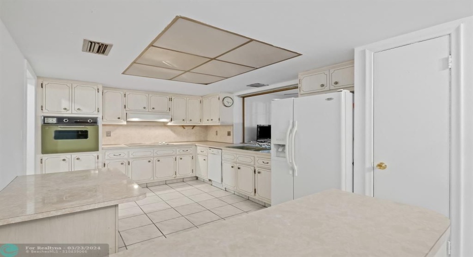 Kitchen sits off of the dining area and Florida room.
