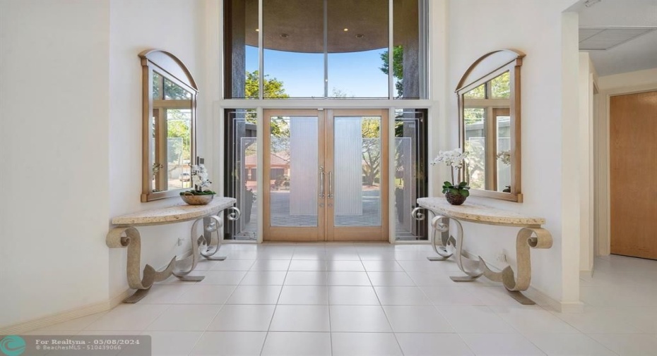 Double door entry welcomes you inside of your new tropical oasis!