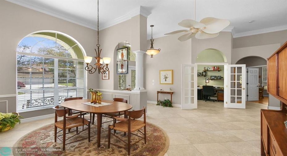FORMAL DINING AND VIEW OF DEN