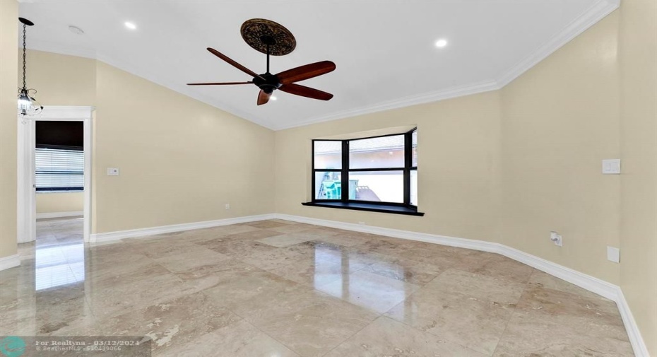 With vaulted ceilings & newly polished travertine floors throughout