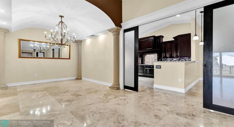 overlooking the kitchen/family rm area with frosted french doors for privacy