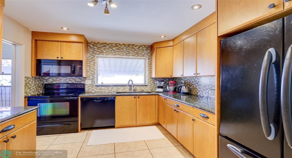 Granite countertops, tile backsplash.