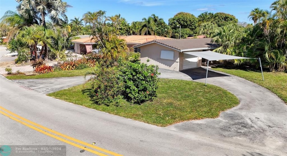 Circular drive provides ample room for car and boat parking.