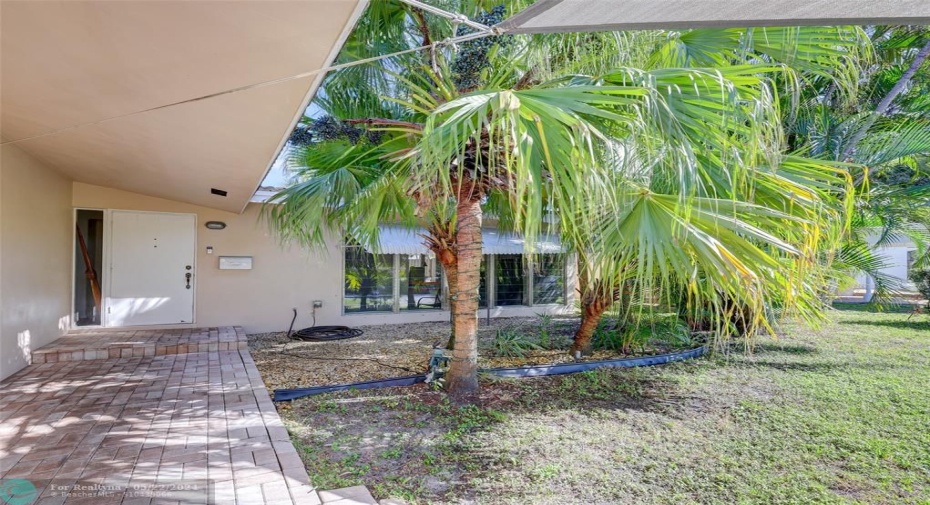 Tree shaded path welcomes you to this charming home.