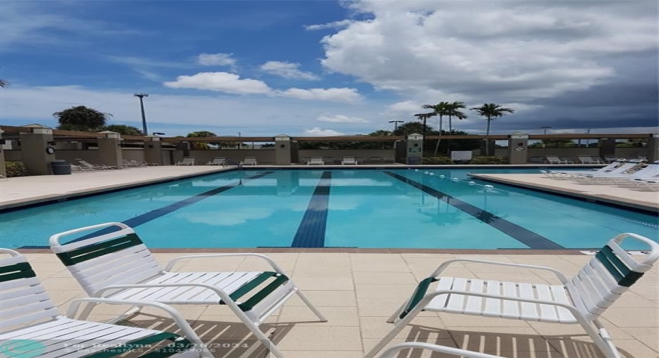 Main Pool with gym, hot tub, and lazy river pool.