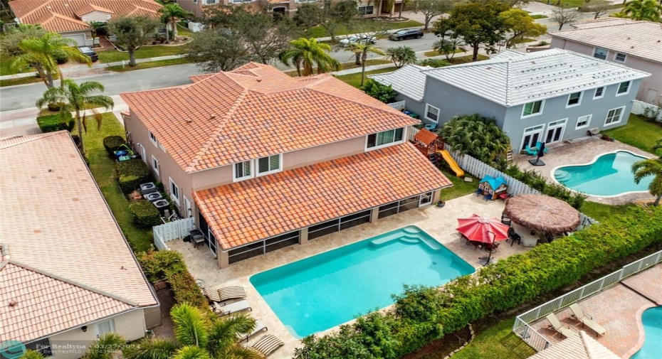 REAR VIEW WITH POOL AND SIDE YARD