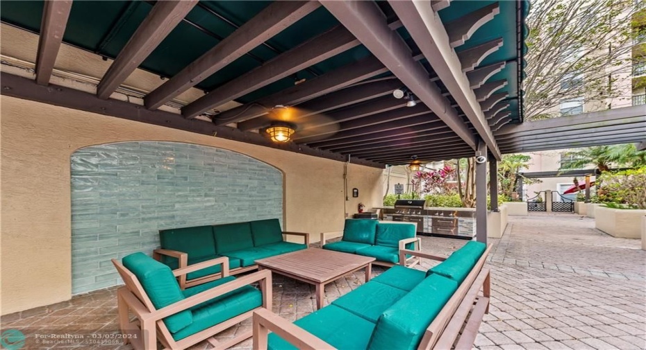 Gorgeous community spaces with seating, lush landscaping, water features & grills