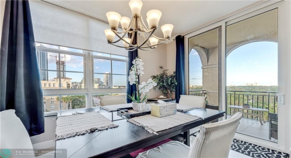 Top floor views of the condo pool, downtown & port from dining room & patio