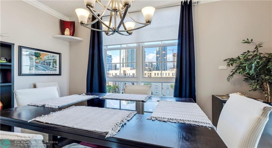 Top floor views of the condo pool, downtown & port from dining room & patio