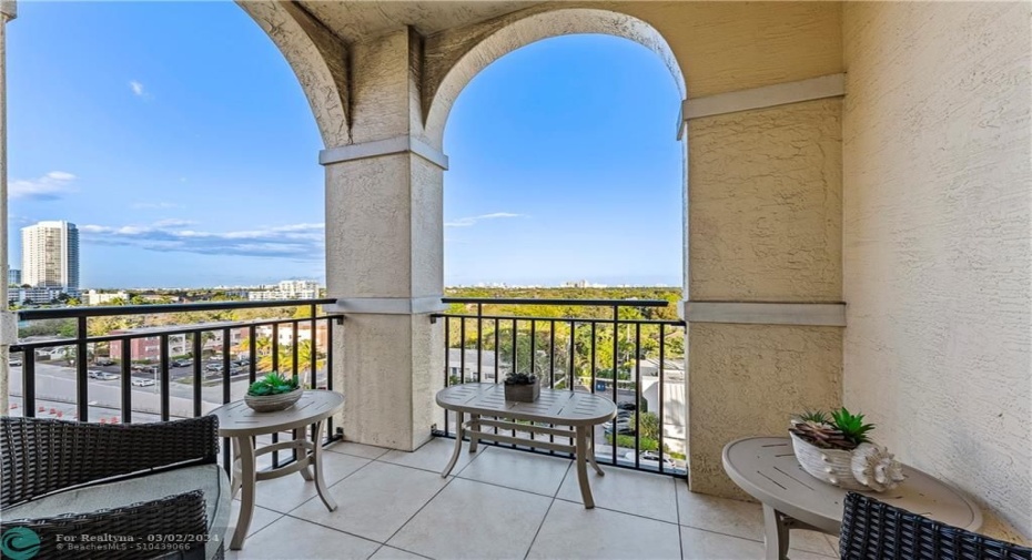Top floor views of the condo pool, downtown & port from dining room & patio