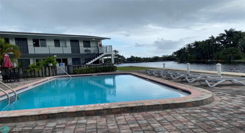 beautiful view of newly redone pool and the new wall