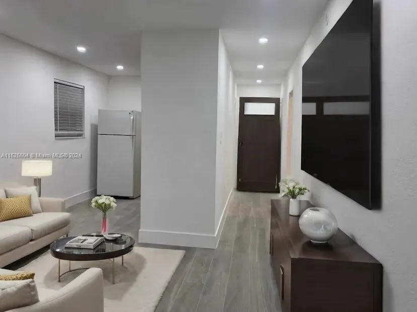 The unit is UNFURNISHED- This photo is VIRTUAL STAGED FOR VISUALIZATION