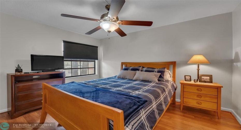 guest bedroom with laminate flooring