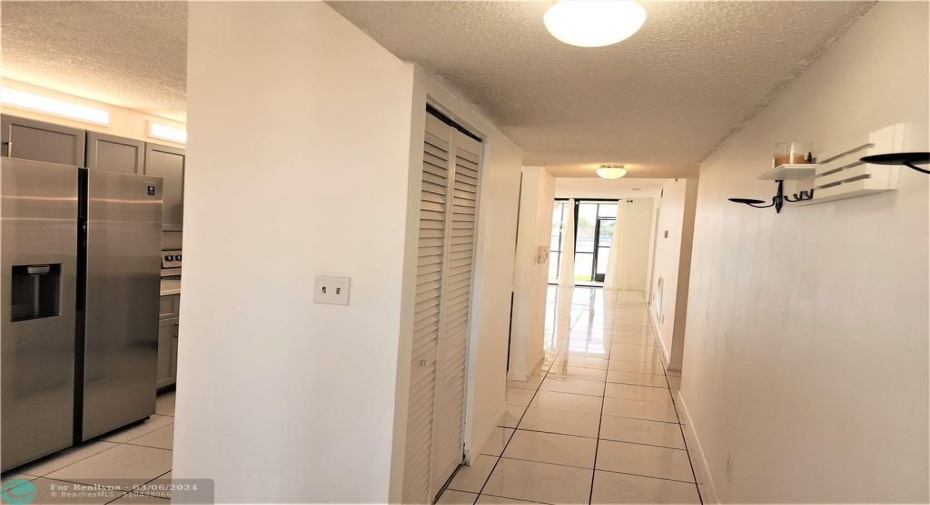 Entrance hall with kitchen on the left- note closet-storage