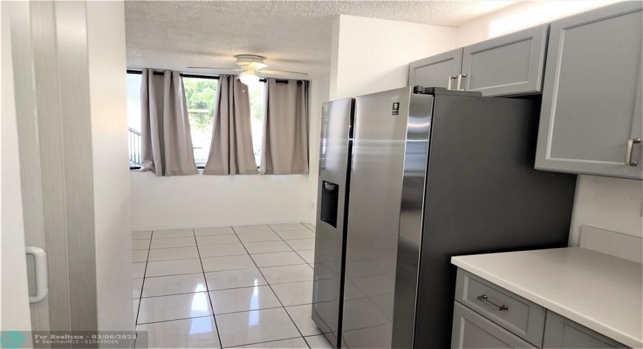 View to the extra room- note the grey pantry door on left